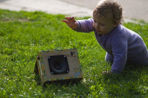 My son about to grab the amp in the grass