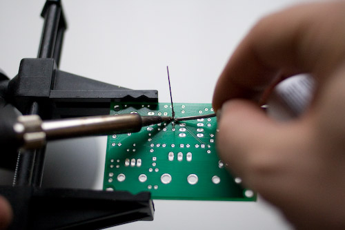 Soldering the leads of the R1 resistor.